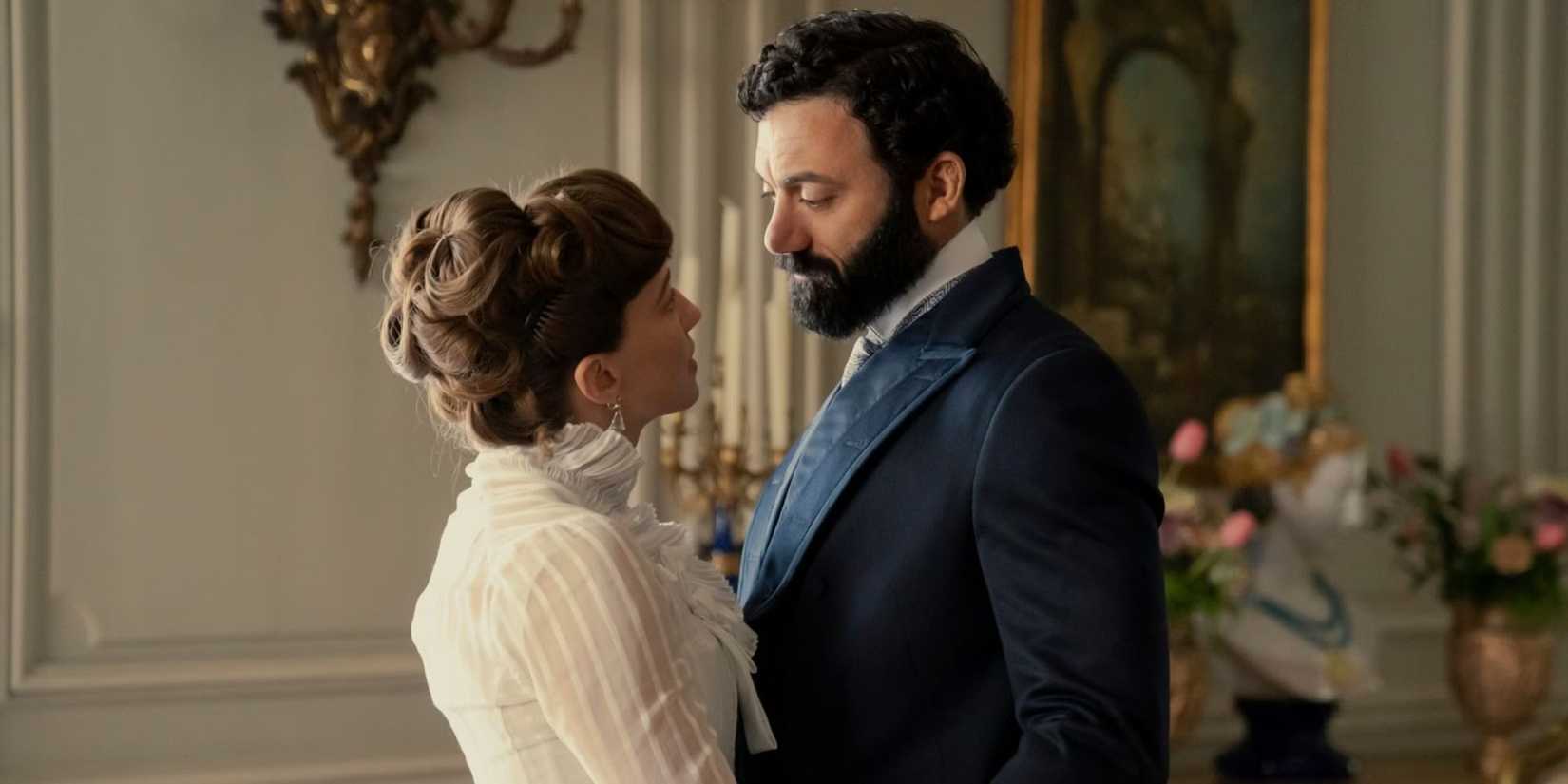 Carrie Coon as Bertha Russell and Morgan Spector as George Russell embracing in Season 2 of The Gilded Age.