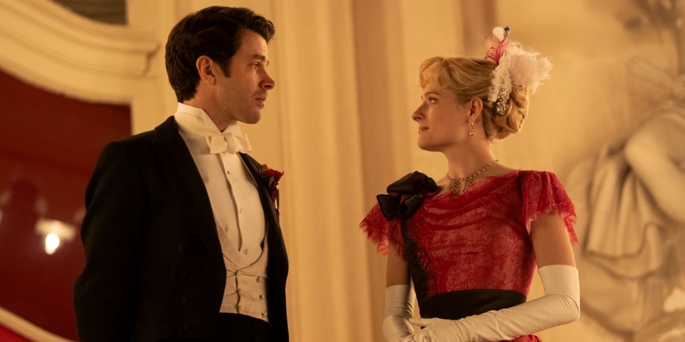 Harry Richardson as Larry standing with Louisa Jacobson as Marian dressed for a ball in The Gilded Age