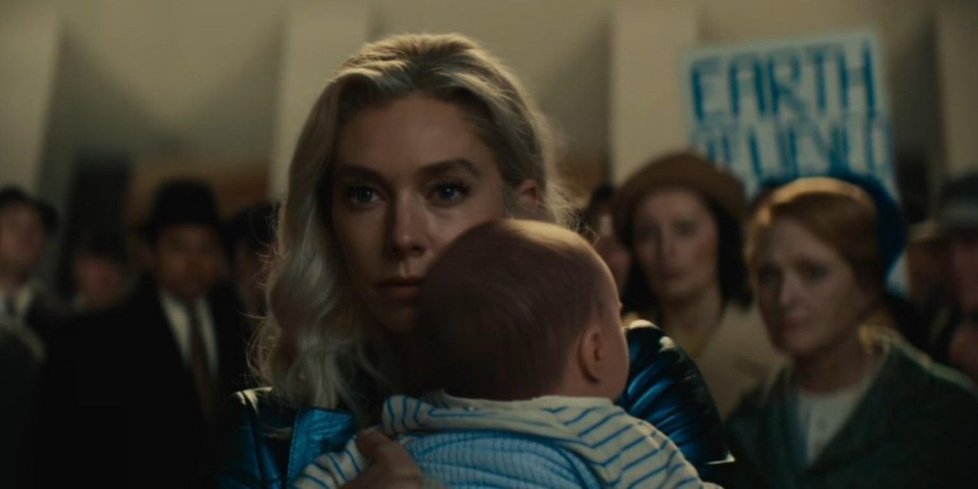 Sue holds Franklin in front of an angry crowd in The Fantastic Four: First Steps.