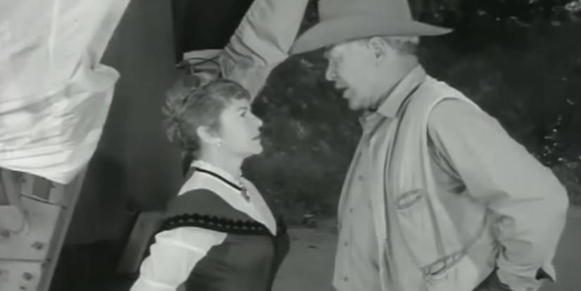 C.L. Harding (Claire Trevor) and Major Seth Adams (Ward Bond) argue in the 'Wagon Train' episode "The C.L. Harding Story."