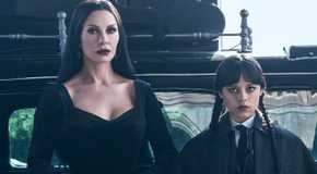 Catherina Zeta-Jones and Jenna Ortega standing side by side and facing ahead in Wednesday Season 2