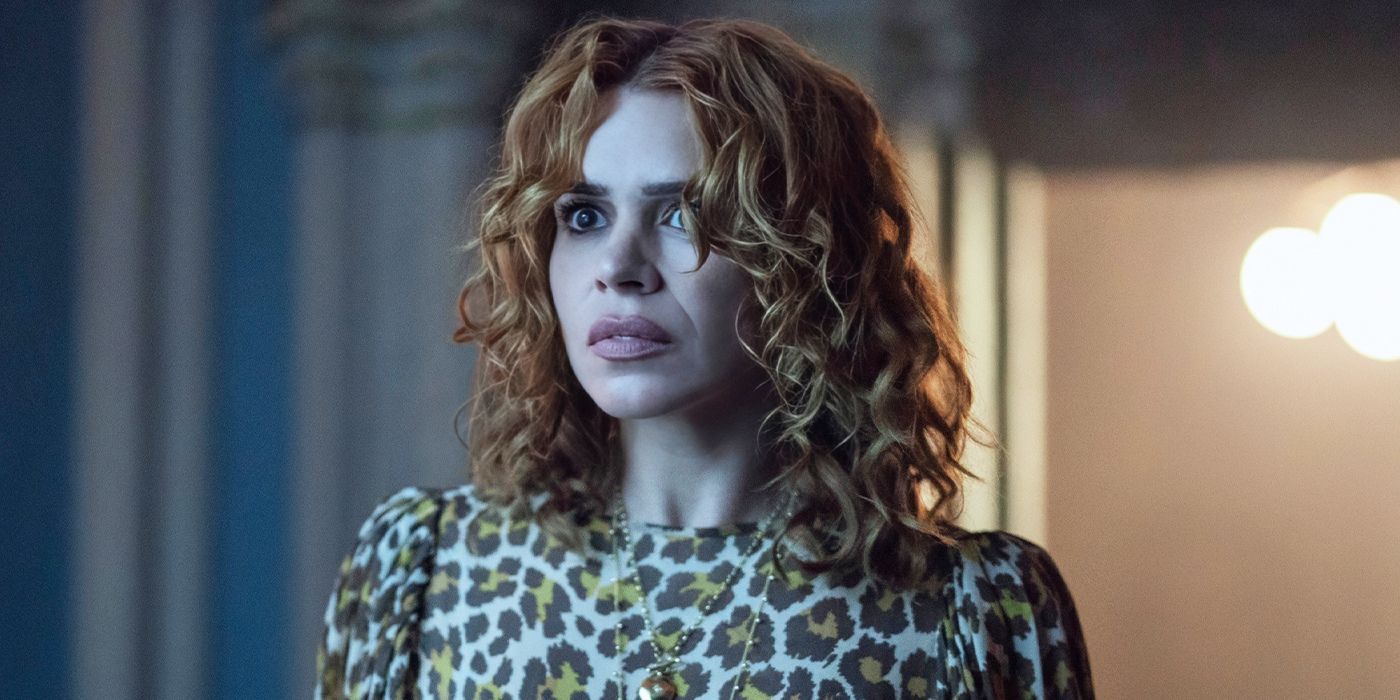 Billie Piper as Isadora in a cheetah-print outfit looking anxious in Wednesday season 2.