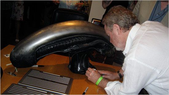 ridley-scott-signing-alien-xenomorph-head-image