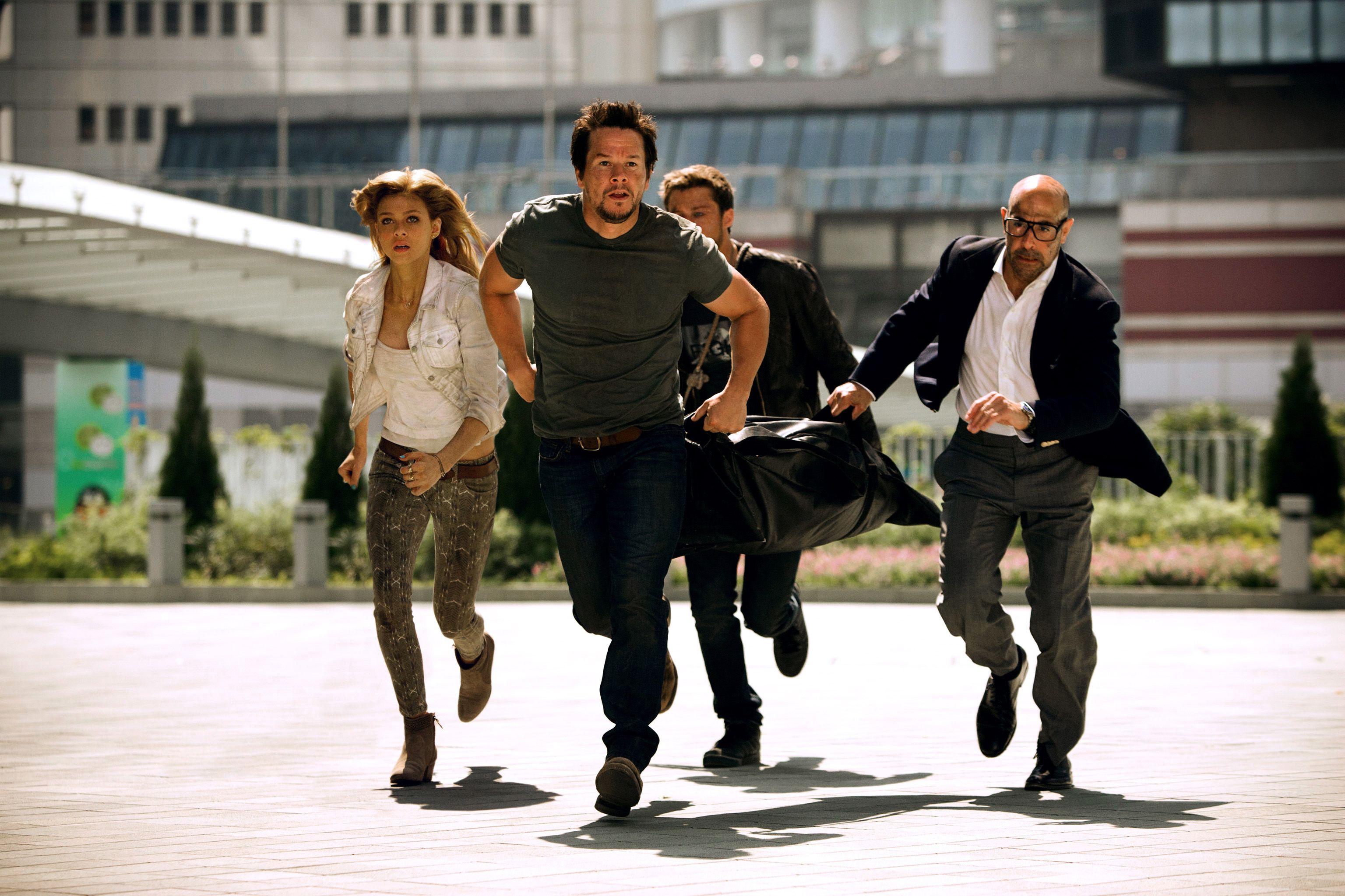 Nicola Peltz, Mark Wahlberg and Stanley Tucci in Transformers: Age of Extinction